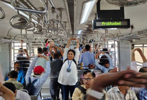 Female Instructors on Mumbai local Train practice Yoga to Commemorate International Women's Day